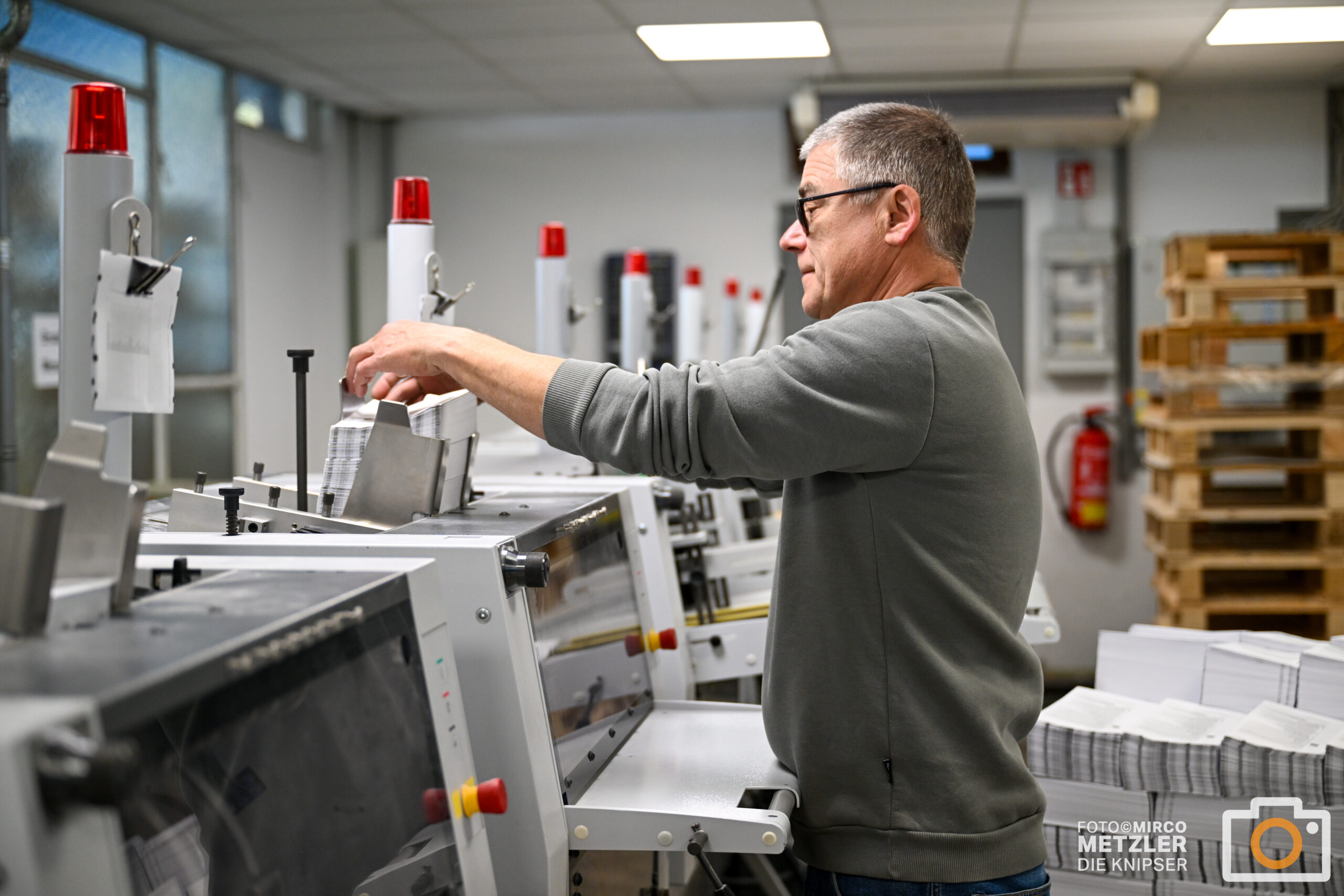 Two people discussing and choosing color palettes for interior design projects.